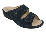 Navy blue sandal with a strap on a white background