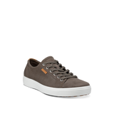 Brown sneaker with white sole on a white background