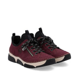 Maroon sneakers with black and beige accents on a white background