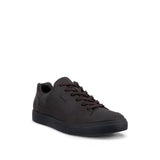 A dark brown leather low-top sneaker with matching brown laces and a black sole, shown from a three-quarters angle on a white background.