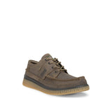 A single brown leather lace-up shoe with a thick textured sole, shown from a three-quarters angle on a white background.