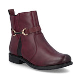 Maroon ankle boot with a strap on a white background