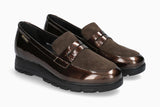 Pair of brown loafers on a white background