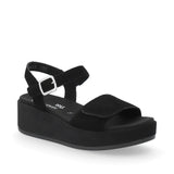 Black wedge sandal with a strap on a white background
