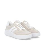 Beige sneakers with white laces and sole on a white background
