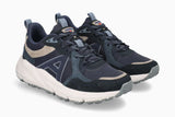 A pair of athletic sneakers in navy blue, dark gray, and beige, featuring a chunky white midsole and a textured gray outsole, shown against a light gray background.