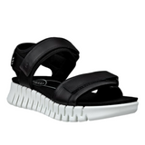 Black sandal with a white sole on a white background