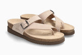 Pair of beige sandals with brown soles on a white background