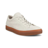 White sneaker with brown sole on a white background