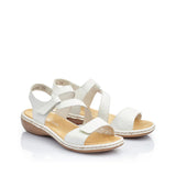 Pair of white sandals with a beige sole on a white background