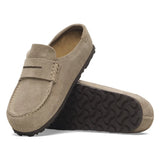 Beige suede loafer shoes with black soles on a white background