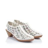 Pair of white sandals with woven design on a white background