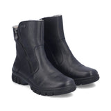 A pair of black leather ankle boots with a side zipper, black soles, and a visible white faux-fur lining at the collar, shown on a plain white background.