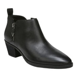 A black pebbled leather ankle boot with a low block heel, side zipper, and pull tab, shown from a three-quarters angle on a white background.